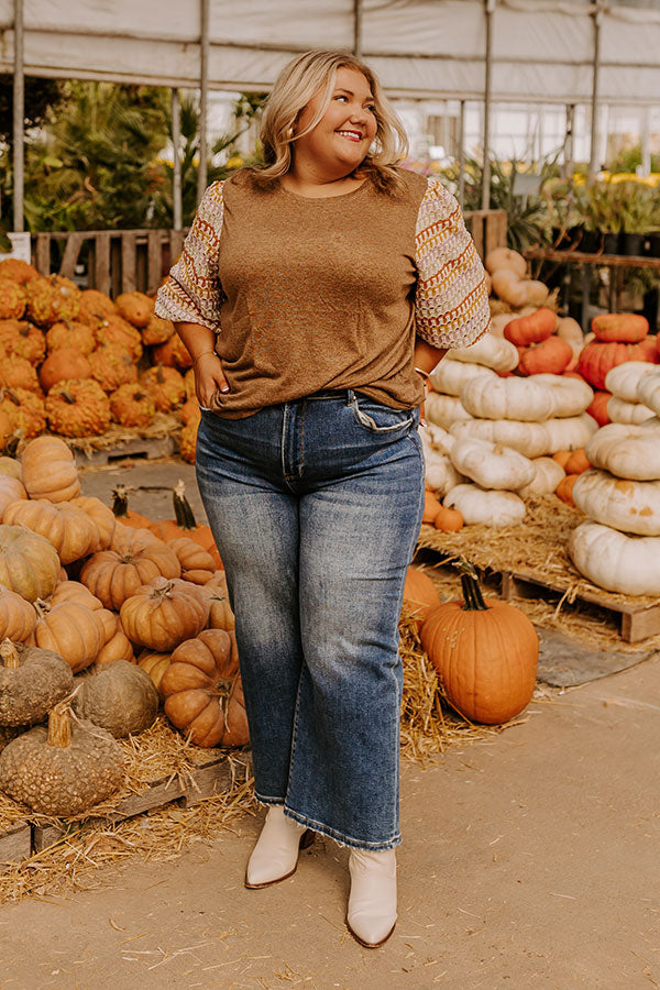 A warm and stylish knit top, perfect for layering in cooler seasons.