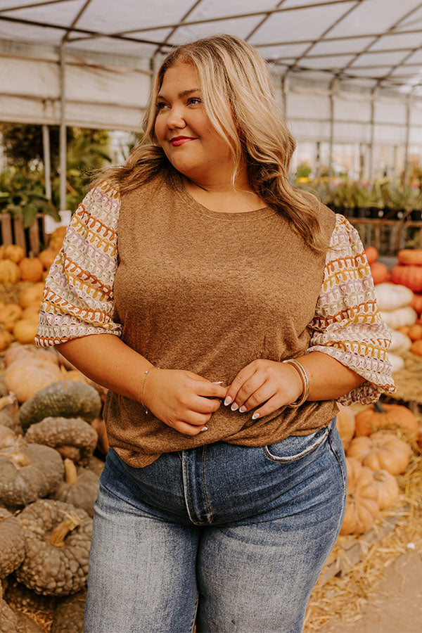 A warm and stylish knit top, perfect for layering in cooler seasons.