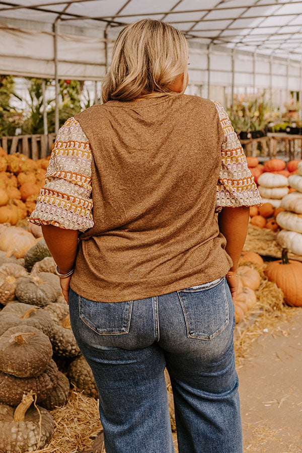 A warm and stylish knit top, perfect for layering in cooler seasons.