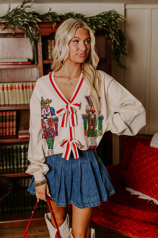 Stylish red cropped sweater with playful Christmas accents, ideal for a bold and trendy holiday outfit that’s effortlessly chic.