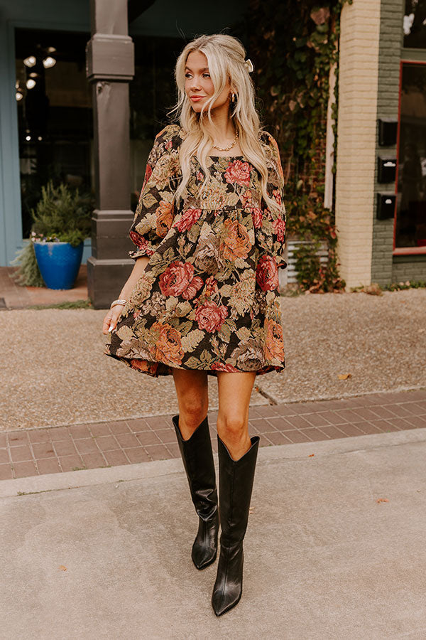 A chic and bold floral mini dress with deep pink and orange blooms, perfect for setting trends and standing out effortlessly.