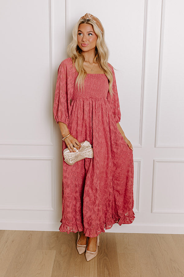 Elegant rustic rose jacquard maxi dress with a smocked bodice and flowy skirt, styled for winter charm.