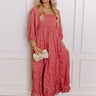 Elegant rustic rose jacquard maxi dress with a smocked bodice and flowy skirt, styled for winter charm.