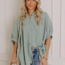 An oversized blue button-up with a relaxed and effortlessly stylish fit.