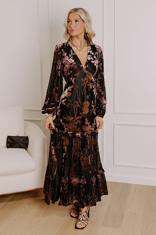Glamorous winter outfit with a black floral maxi dress, styled for evening occasions.