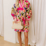 A playful pink mini dress with a fresh and floral design.