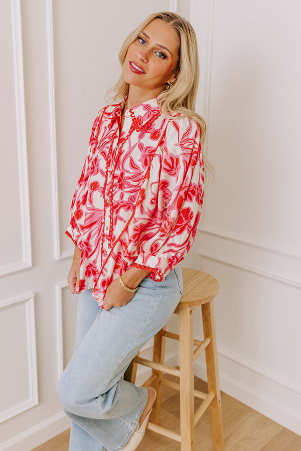 A dreamy floral top with delicate details for a romantic touch.