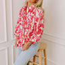 A dreamy floral top with delicate details for a romantic touch.