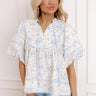 A feminine floral top with charming, vintage-inspired details.