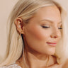 Melinda Maria Beacon 1 inch Hoop Earrings in Gold Image - 1