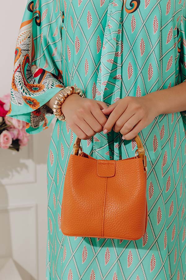 Cue The Chic Faux Leather Bucket Bag in Orange