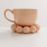 Spill The Tea Stoneware Mug in Peach Image - 1