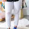 The Carson Distressed Mid Rise Skinny in Optic White Image - 1