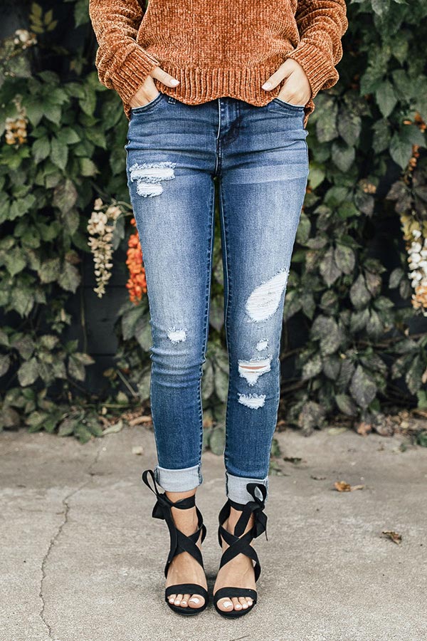 The Flora Mid Rise Distressed Skinny