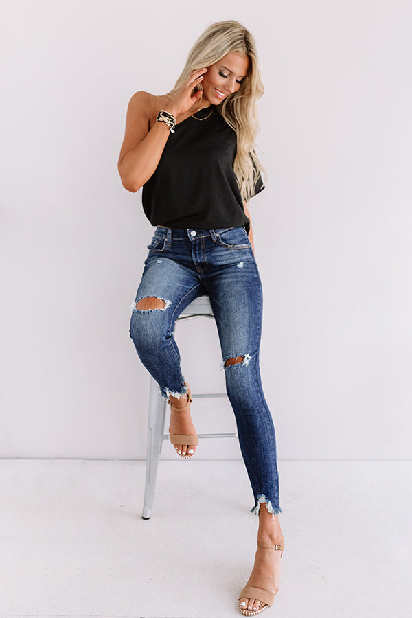 The Harlon Midrise Distressed Ankle Skinny