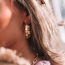 Take Me To Versailles Small Hoop Earrings In Gold Image - 1