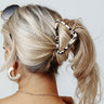 Drop The Mic Hair Claw In White Cow Print Image - 1