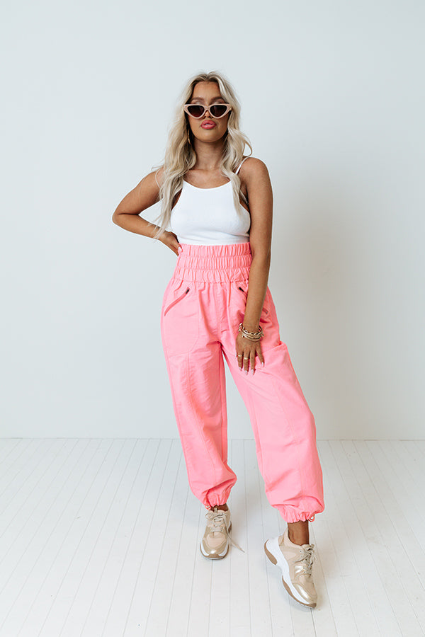 The Huxley High Waist Windbreaker Pants In Neon Pink